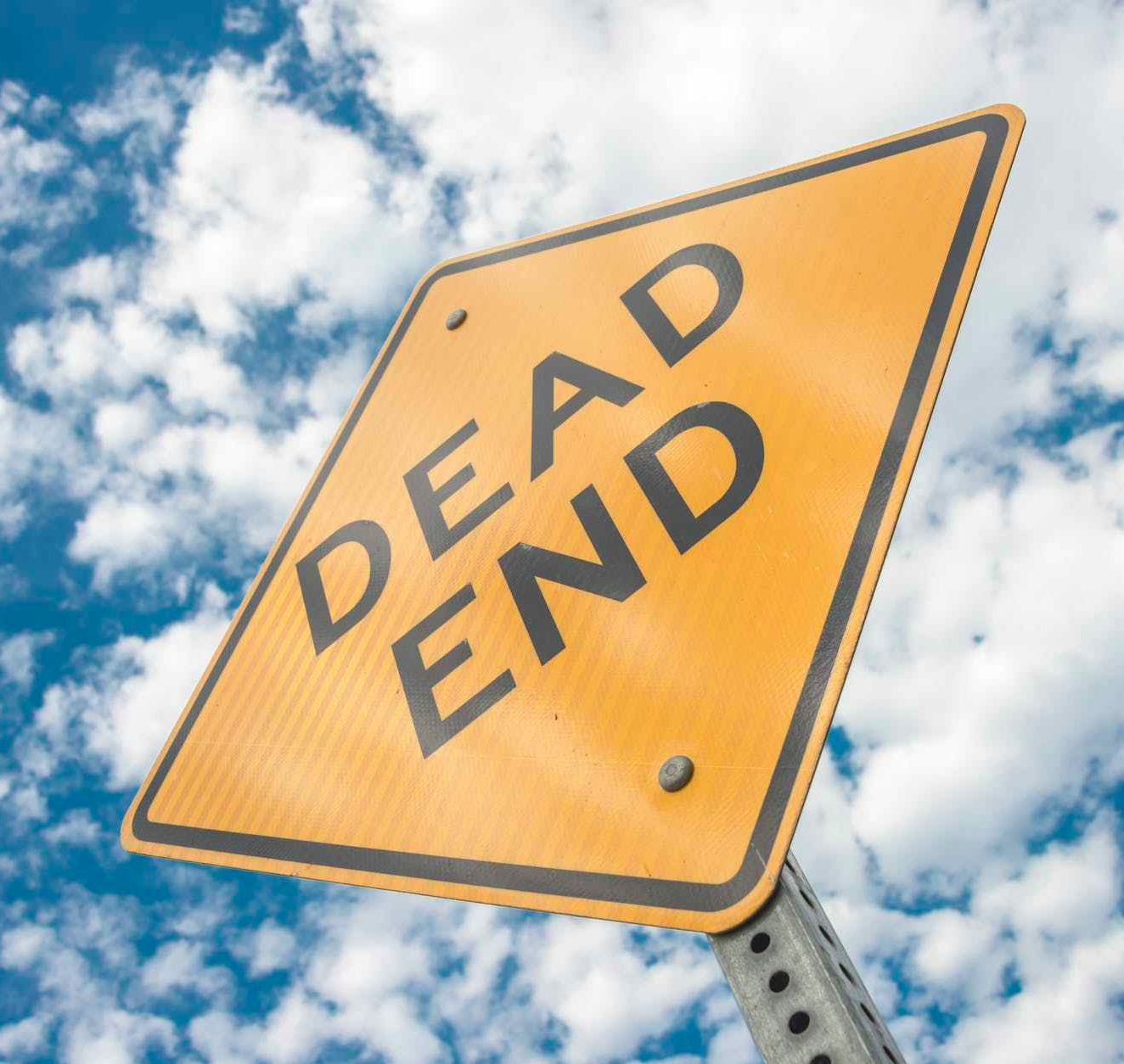 yellow dead end sign during day time