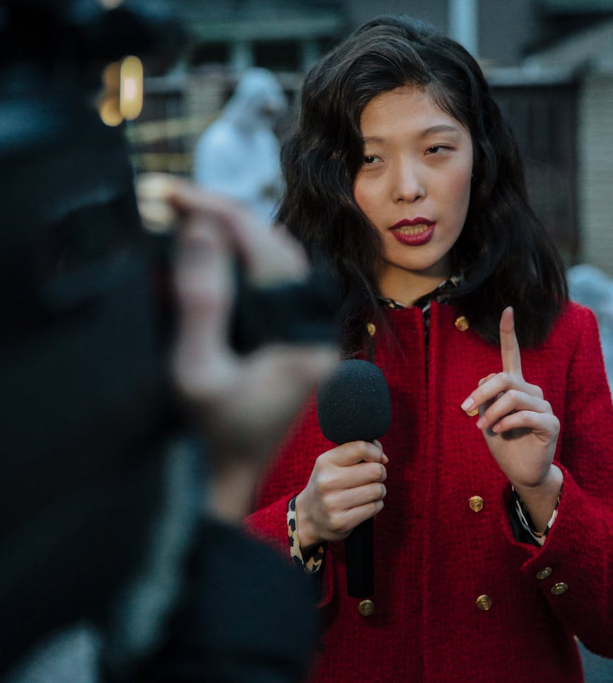 a woman reporting news on the crime scene
