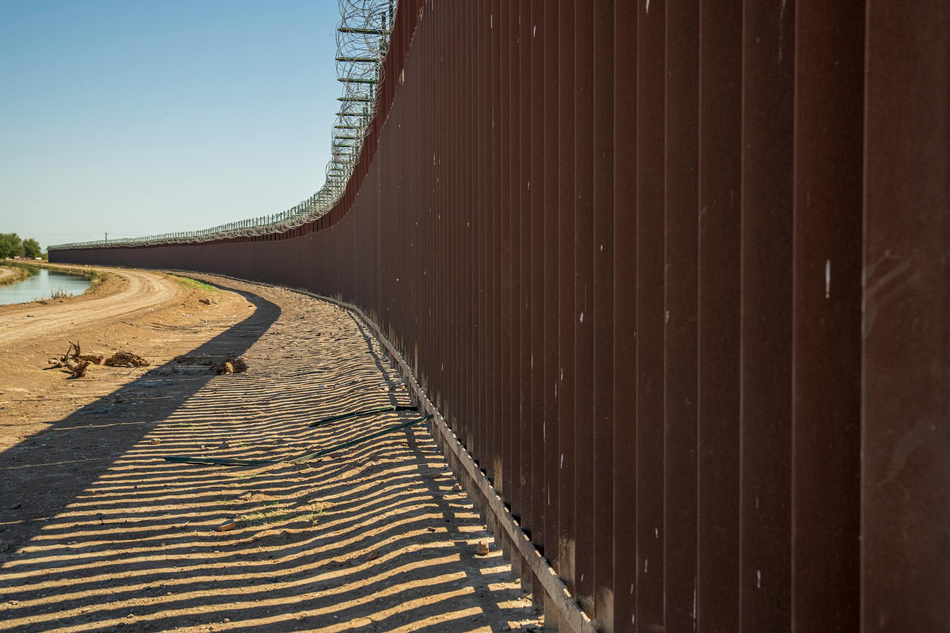 border wall at river bank